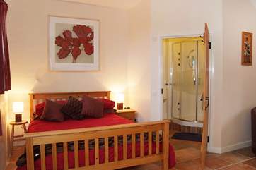 The generous master bedroom has an en suite shower-room.