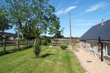The garden at the back of the cottage is fully enclosed and now includes a hot tub at the end of the garden by the small bush.