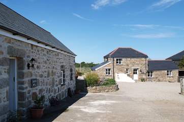 Sunset Barn is across the gravelled courtyard from single-storey Sunrise Barn.