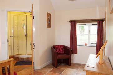 The master bedroom is spacious and light with countryside views.