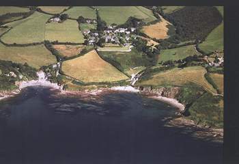 An aerial photograph of Talland Bay, with the beach on the left a few minutes' walk down the hill from Fred's House.