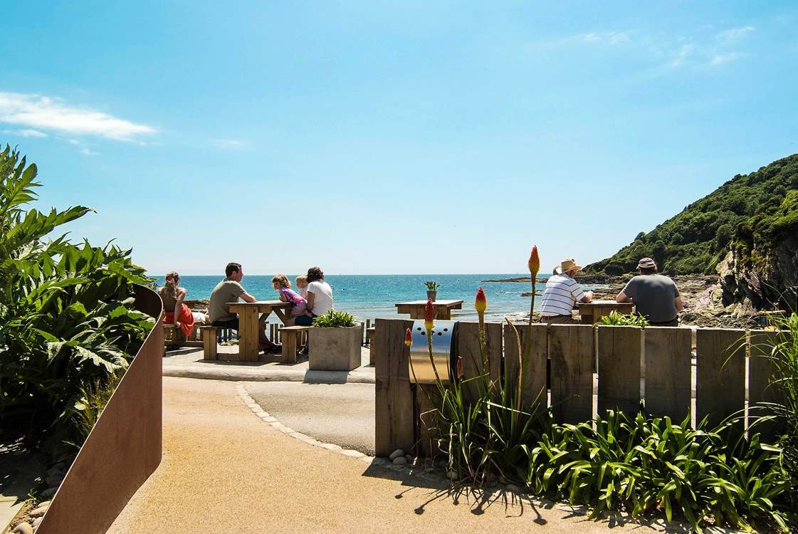 A short stroll down the road to the beach and beach café-  a great place for a bite to eat! (Not the view from the property)