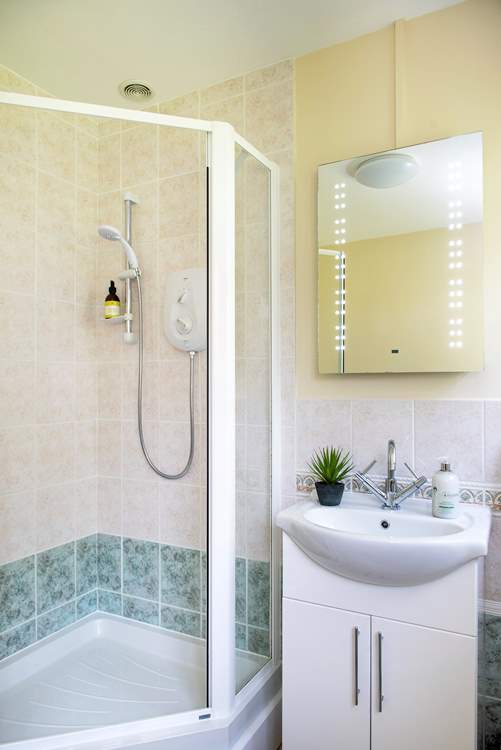 The family bathroom is on the ground floor and has a separate shower cubicle.