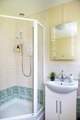 The family bathroom is on the ground floor and has a separate shower cubicle.