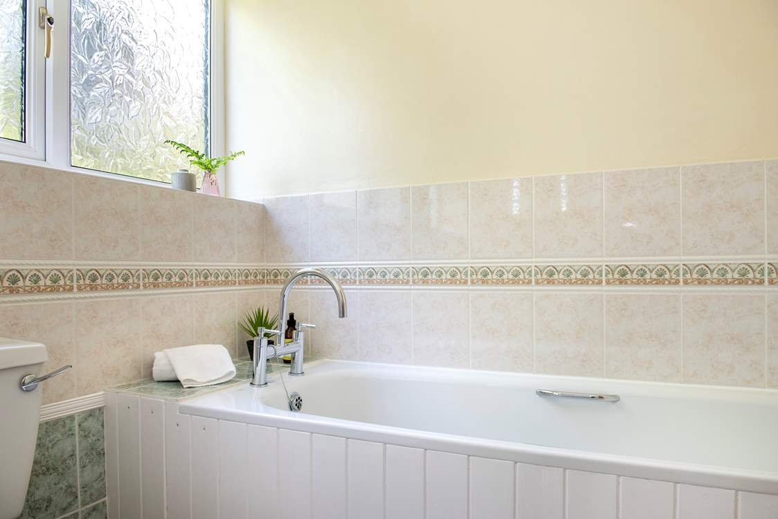 There is also a separate bath in the family bathroom.