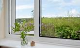 The second bedroom enjoys views of both the countryside and coastline. - Thumbnail Image