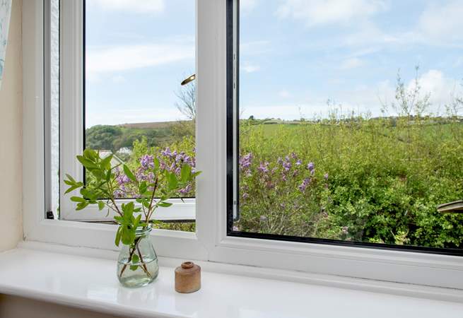 The second bedroom enjoys views of both the countryside and coastline.