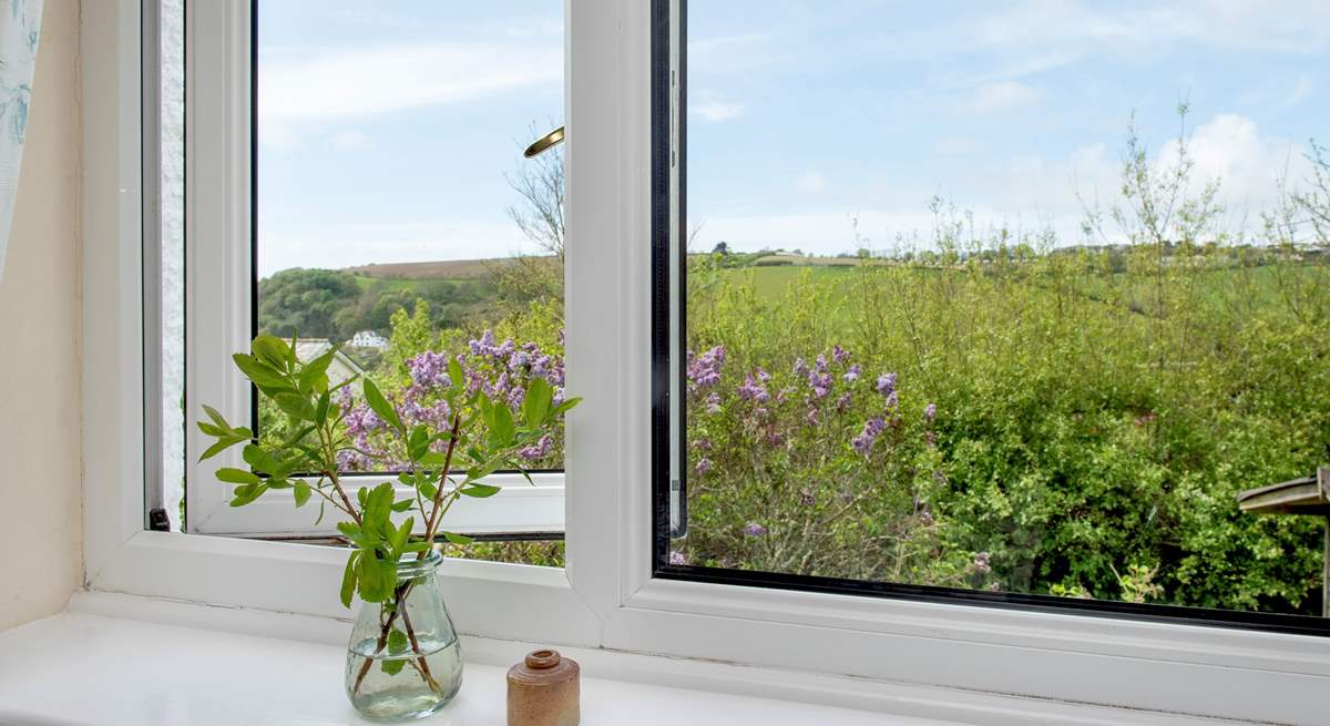 The second bedroom enjoys views of both the countryside and coastline.