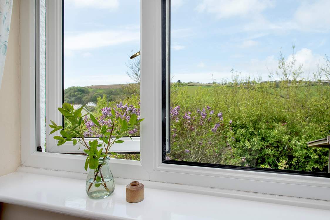 The second bedroom enjoys views of both the countryside and coastline.