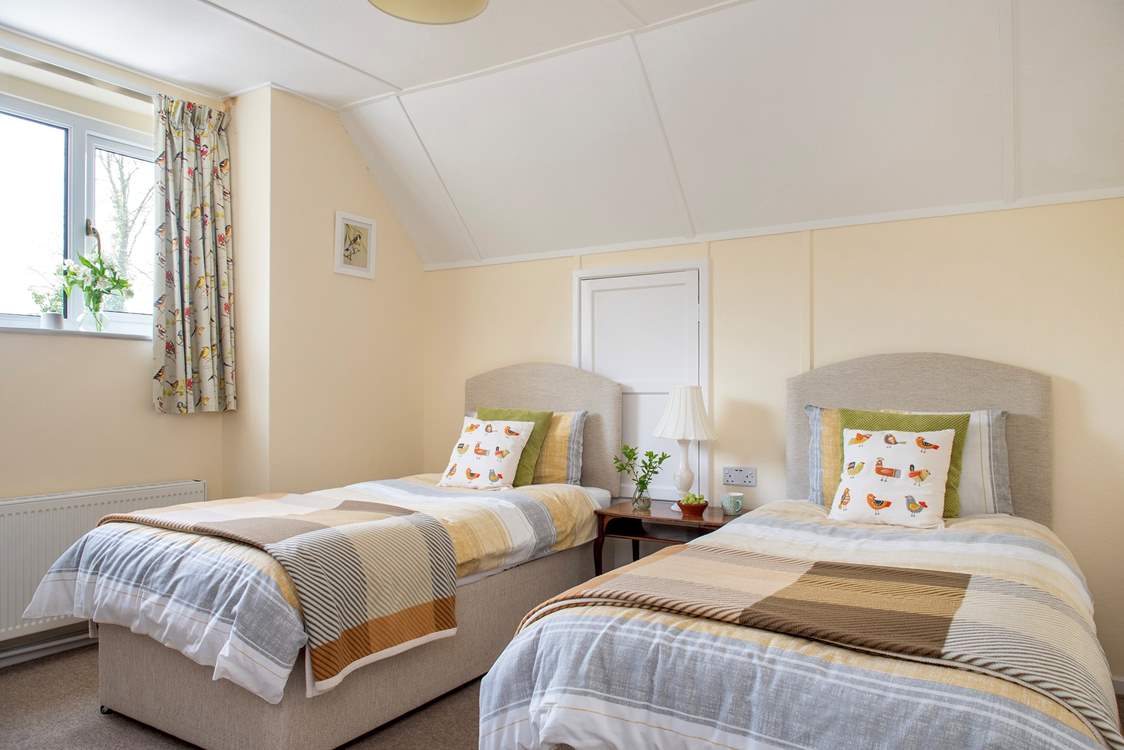 Twin beds await in the third bedroom.