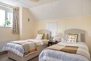 Twin beds await in the third bedroom.