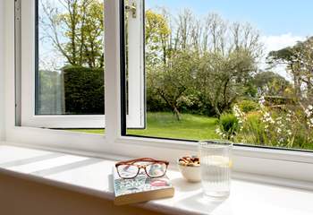 The sitting rooms enjoys views over the garden.