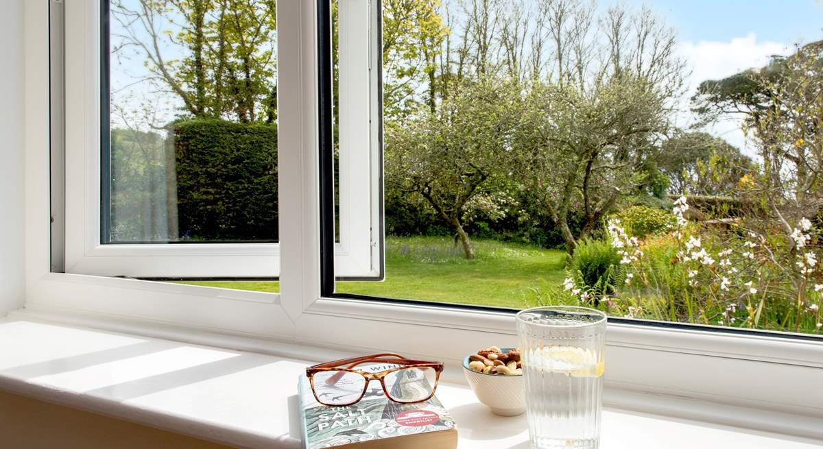 The sitting rooms enjoys views over the garden.