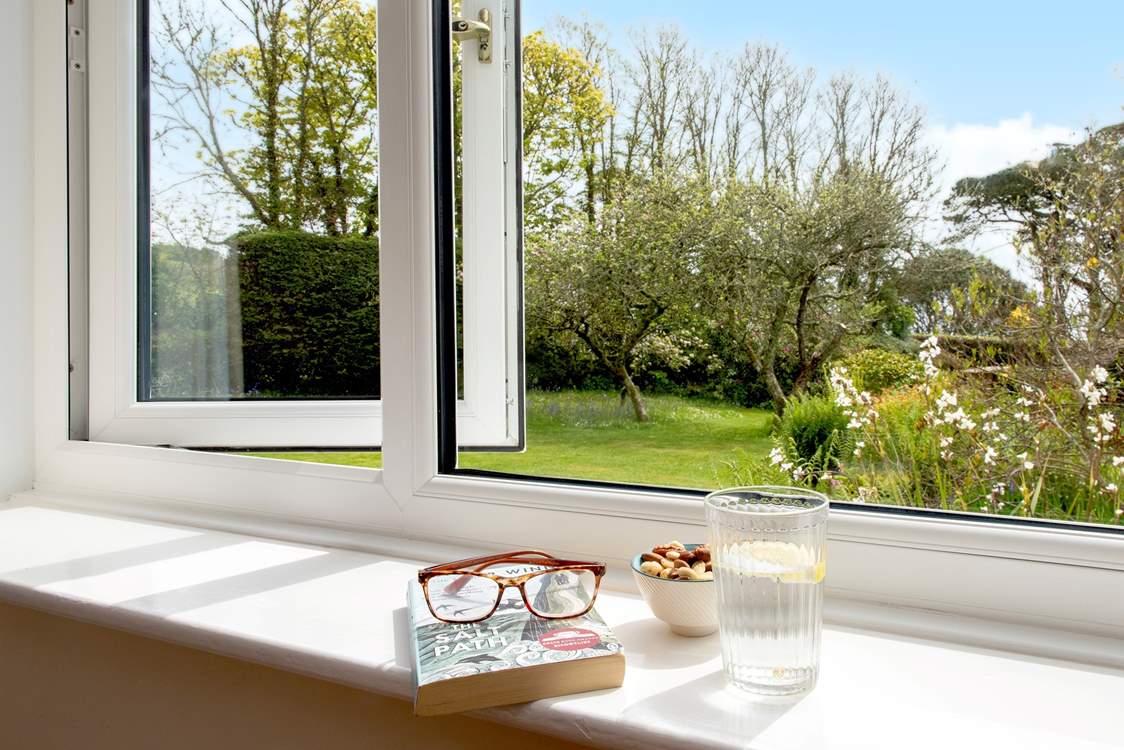 The sitting rooms enjoys views over the garden.