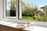 The sitting rooms enjoys views over the garden.