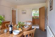 The kitchen leads off from the dining room.