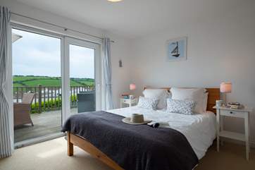 Bedroom 2 has a king-size (5') double bed and patio doors onto the deck.