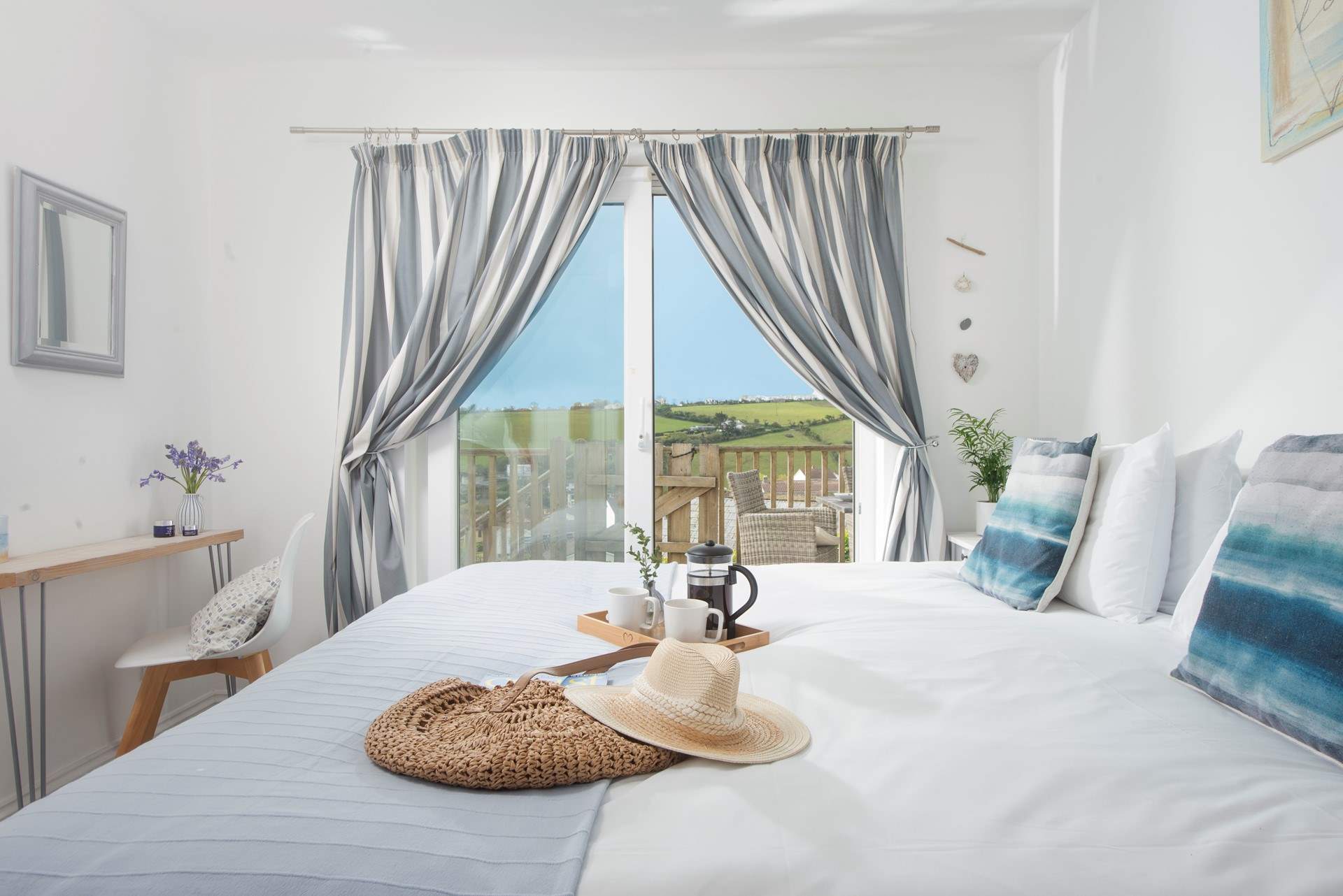 Bedroom 1 has 'zip and link' beds (3' twin beds or a 6' super-king size double bed) and patio doors onto the deck.