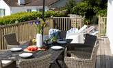 Enjoy dinner al fresco on the dining area out on the deck. - Thumbnail Image