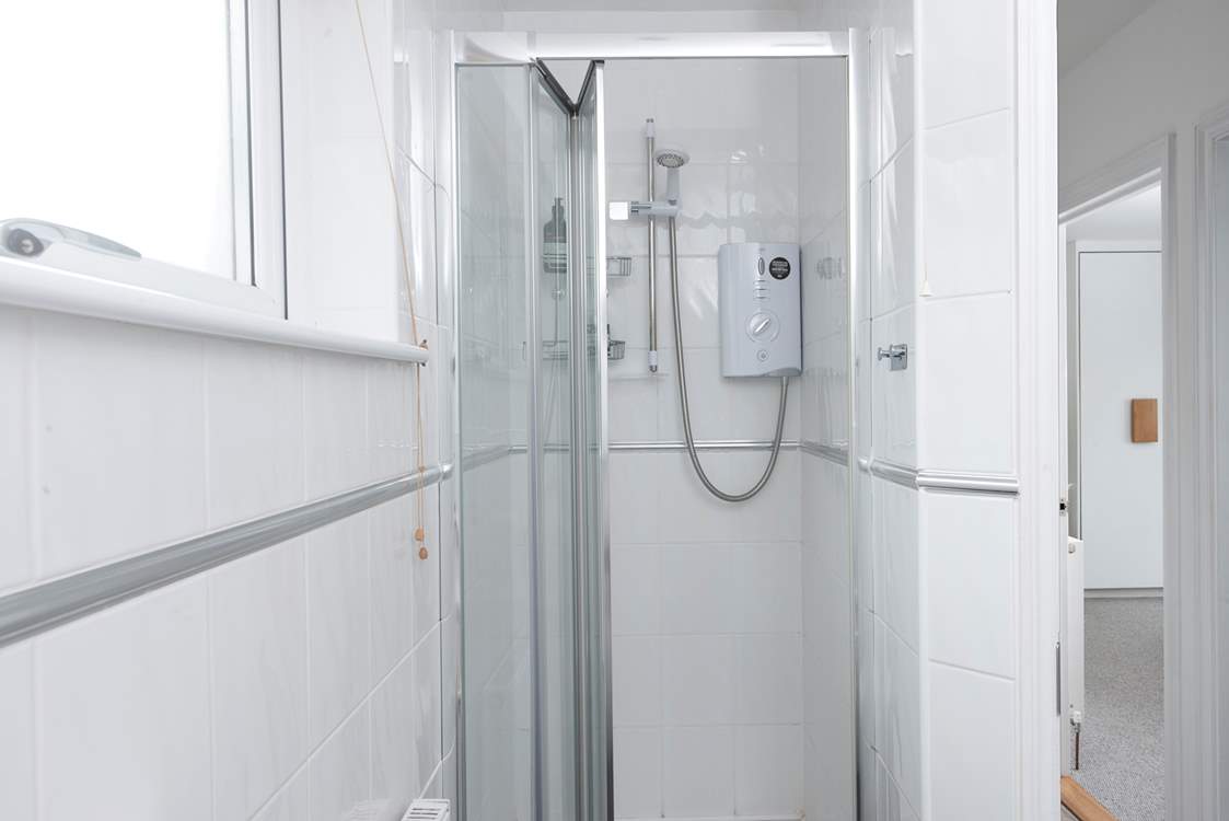 There is a separate shower cubicle in the family bathroom.