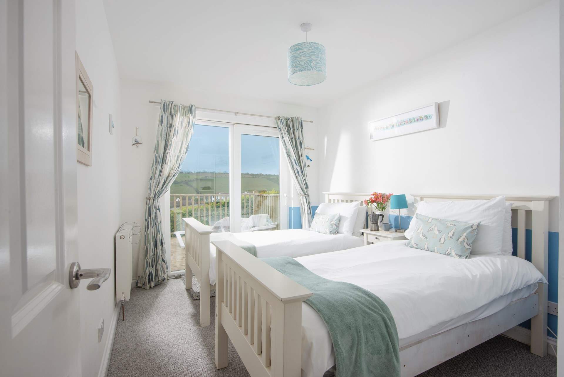 Bedroom 3 as twin beds (3') and patio doors that lead onto the deck.