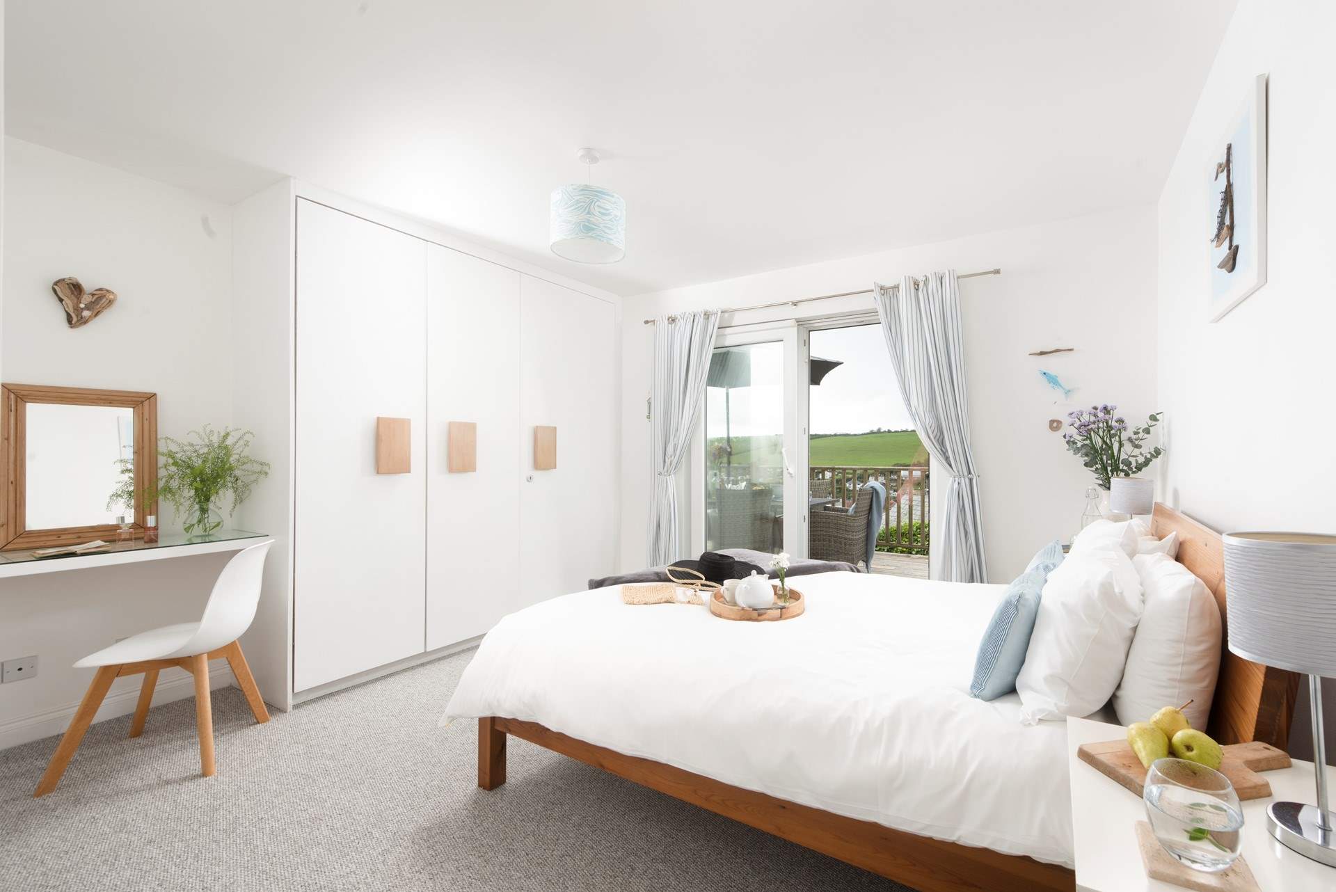 Bedroom 2 has a king-size (5') double bed and patio doors onto the deck.
