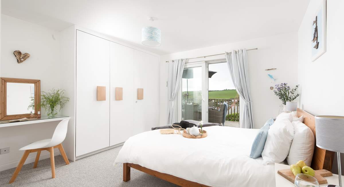 Bedroom 2 has a king-size (5') double bed and patio doors onto the deck.