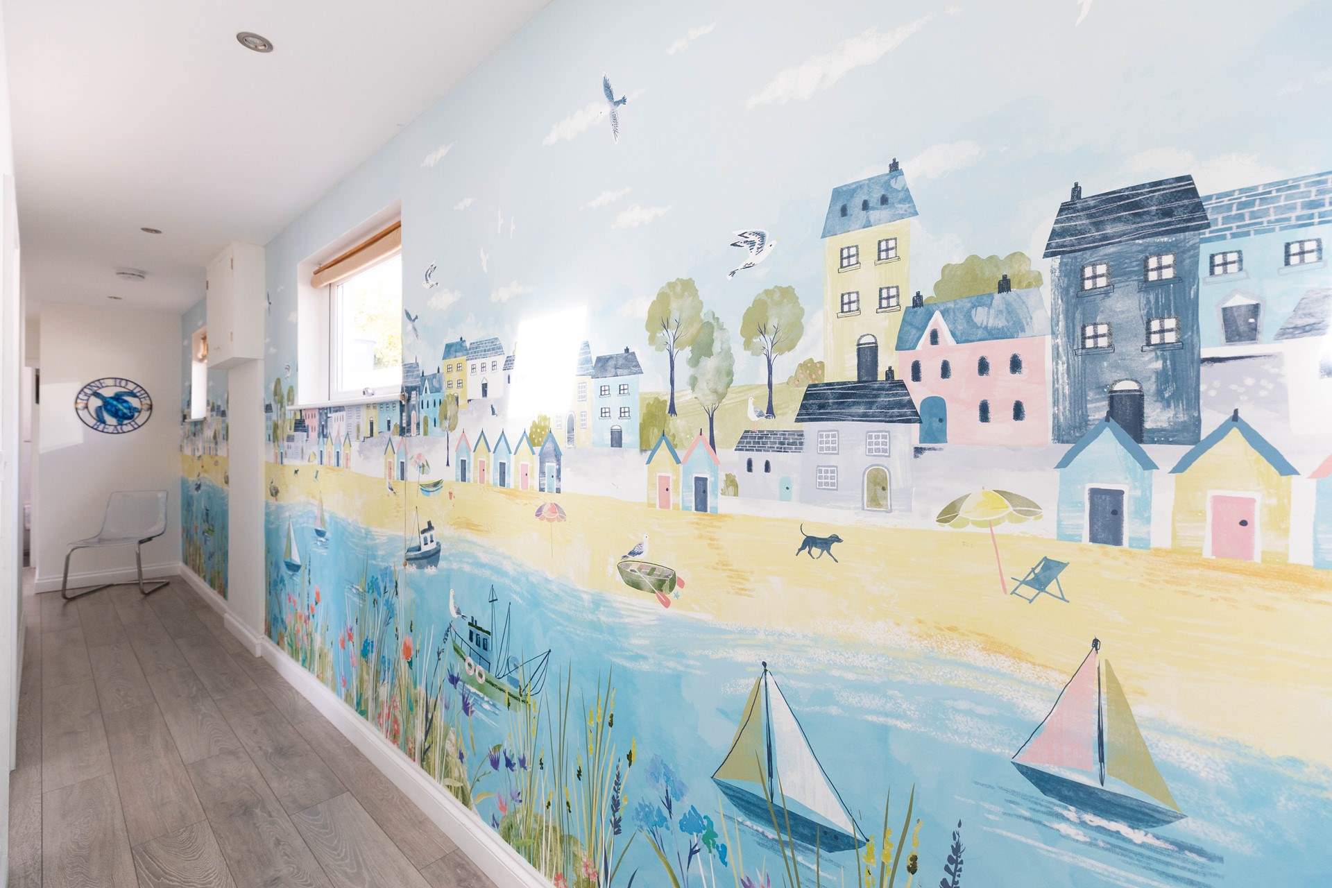 Quirky seaside themed artwork adorns the walls. 