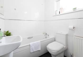 The family bathroom has a bath with separate shower cubicle. 