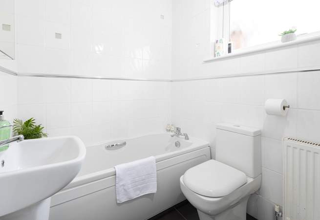 The family bathroom has a bath with separate shower cubicle. 