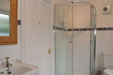 This shower-room is en suite to Bedroom 1 and can also be accessed from the hall.