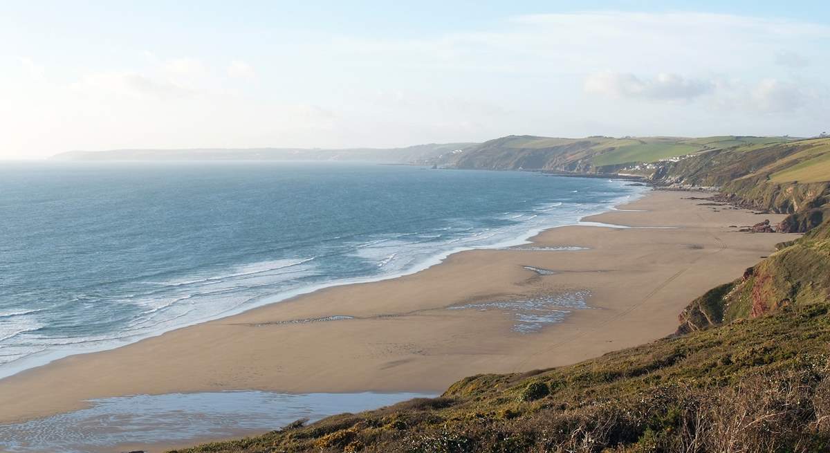 A footpath winds its way down the cliff to wonderful Long Sands below Tregantle Fort.