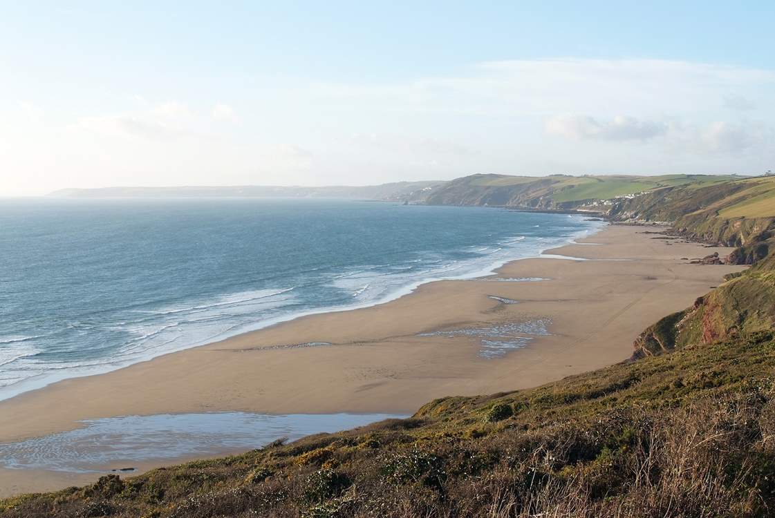 A footpath winds its way down the cliff to wonderful Long Sands below Tregantle Fort.