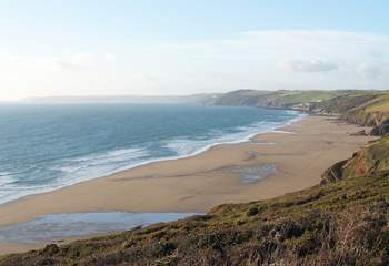 A footpath winds its way down the cliff to wonderful Long Sands below Tregantle Fort.