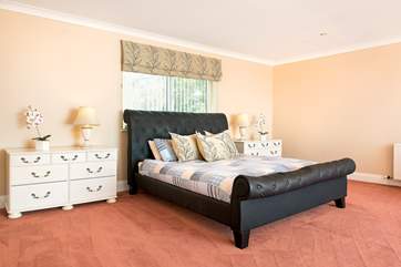 Bedroom 2 is huge and has a super-king size bed, dressing-area and an en suite bathroom.