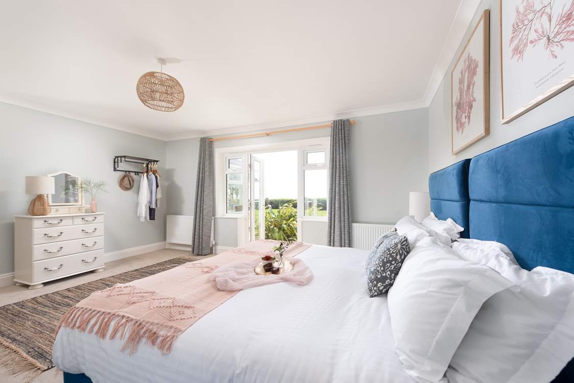 Bedroom 1 is wonderfully light and airy with double doors leading out to the garden.