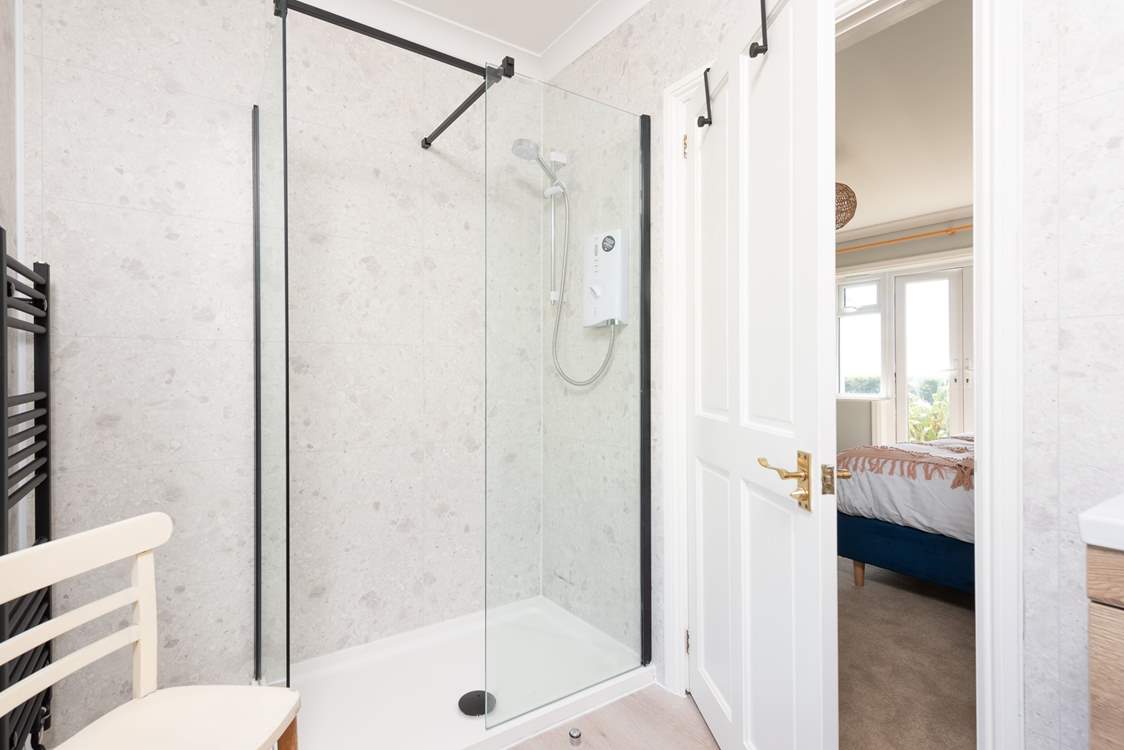 Bedroom 1 has a very stylish en suite shower-room.