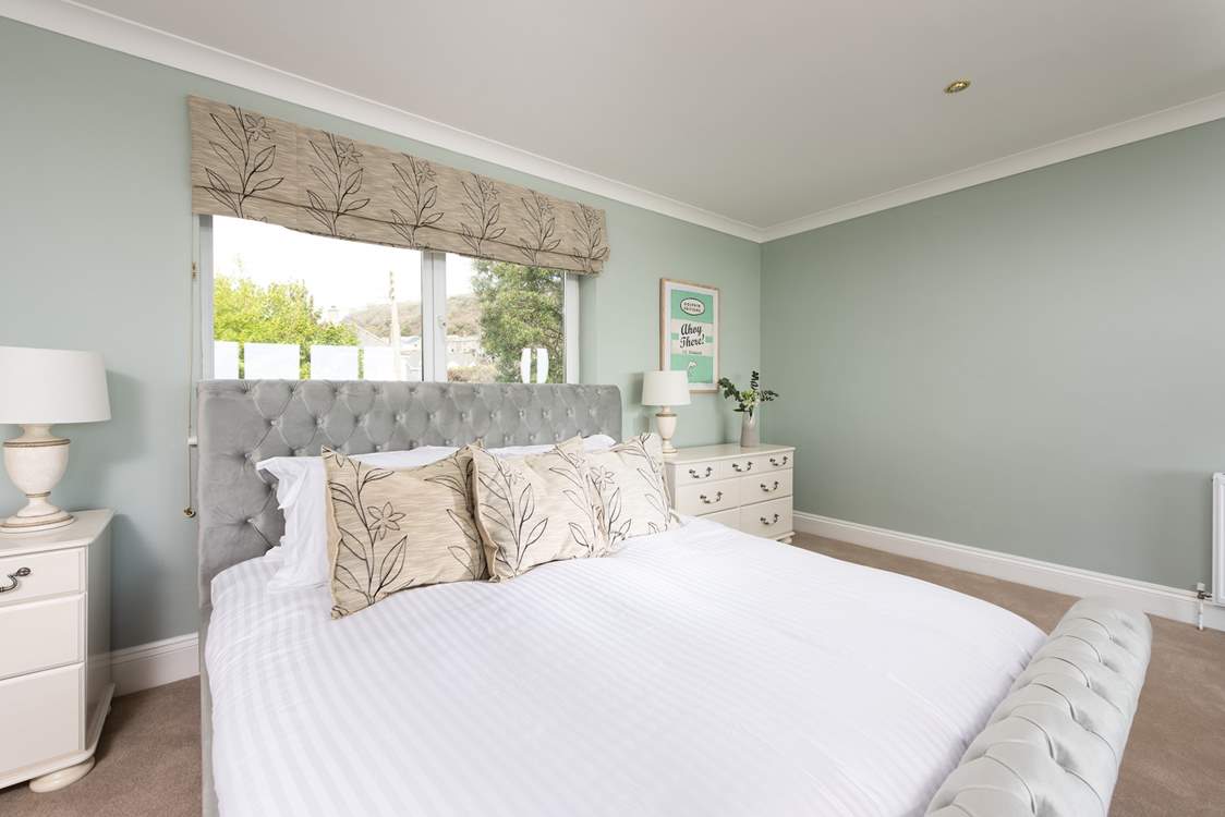 A huge super-king size sleigh bed awaits in the second bedroom.