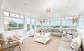 The sunny conservatory end of the sitting-room with double doors leading out to the decking and garden. - Thumbnail Image