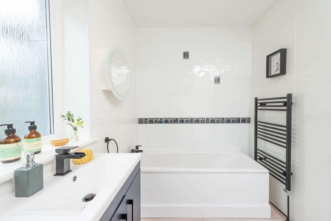 The en suite has the luxury of a bath and separate shower cubicle.