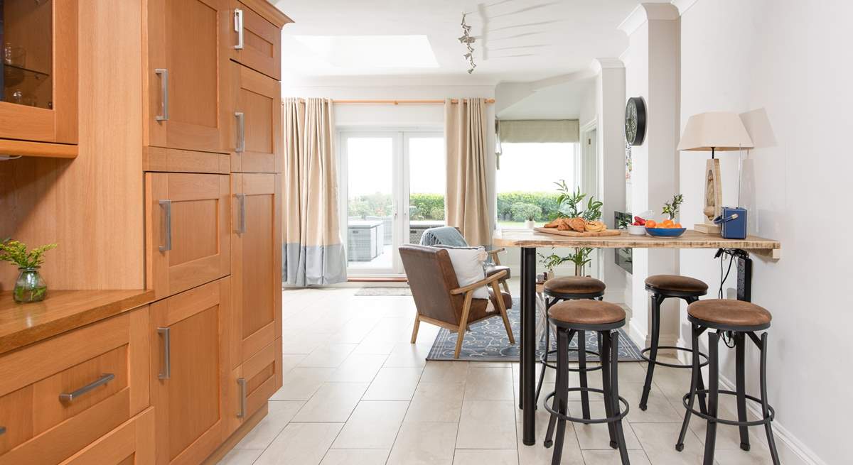 Leading off from the dining table is a little snug area and the breakfast bar.