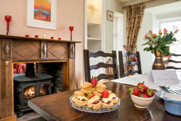 The wood-burner warms both the dining-room...