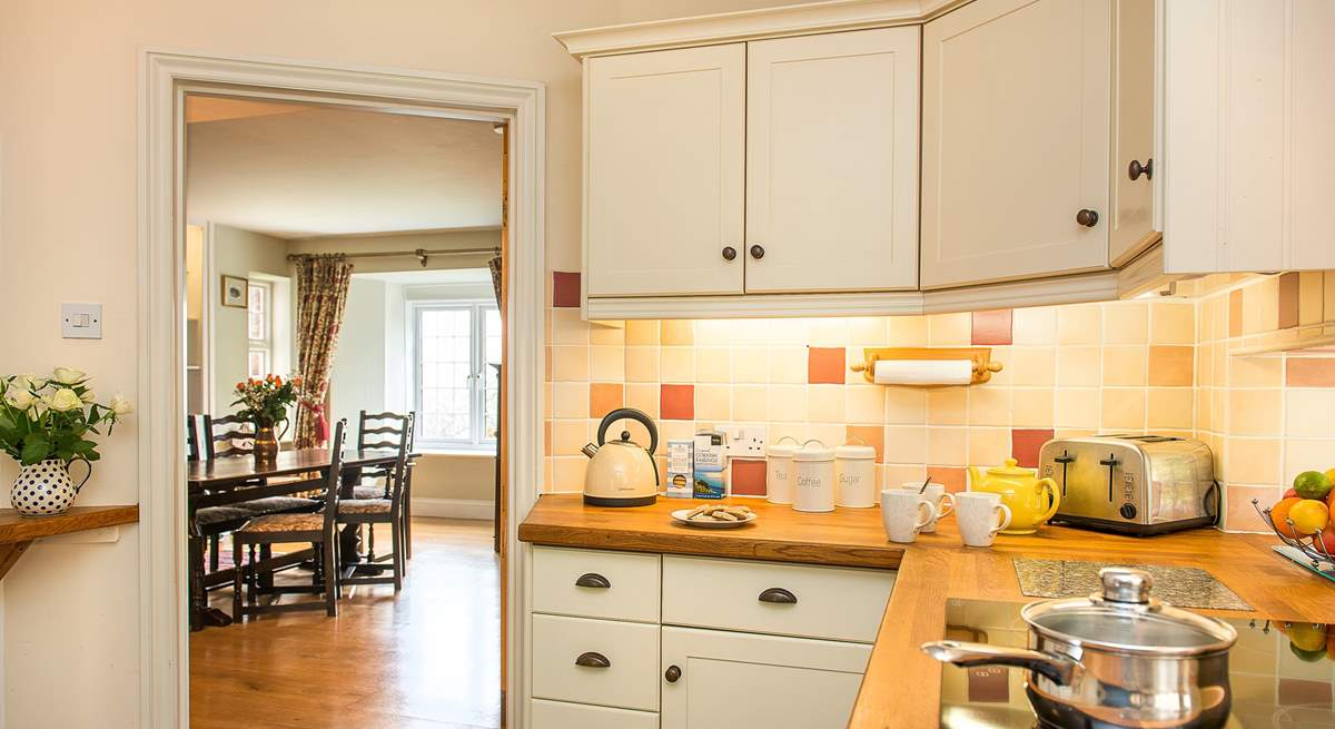 Beautiful wooden floors run from the kitchen through to the dining-room.