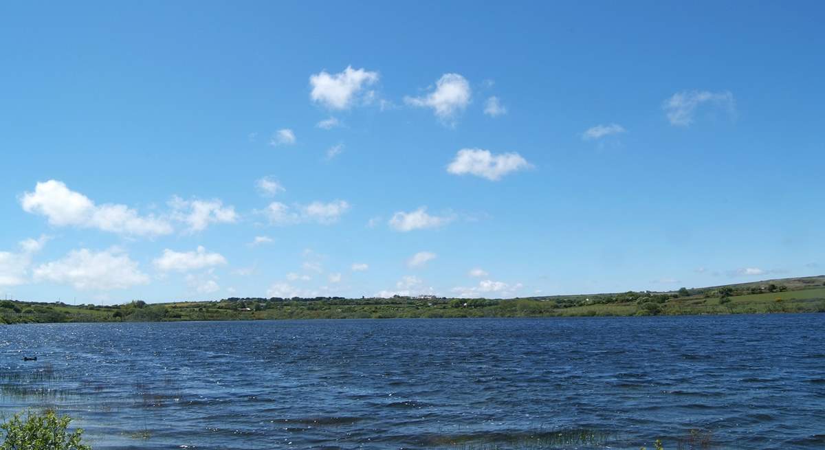 Looking back from the footpath which circles the reservoir, Mount Wise Cottage is just visible in the distance (left of centre in the photograph).