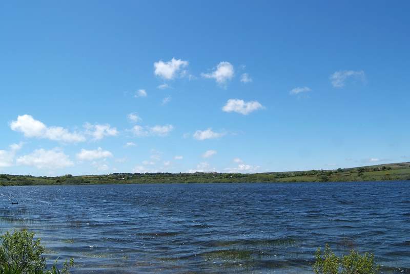 Looking back from the footpath which circles the reservoir, Mount Wise Cottage is just visible in the distance (left of centre in the photograph).