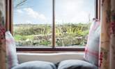 The sitting/dining-room looks out across the enclosed front courtyard to the fields and reservoir beyond. - Thumbnail Image