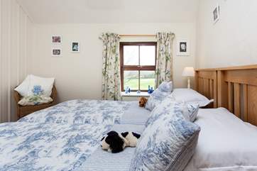 The pretty twin bedroom, has lovely views.