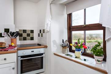 The kitchen looks out across the fields.