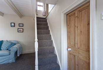 The steep cornish staircase takes you up to the first floor, there is a small step either side of the stairs, leading into the bedrooms.