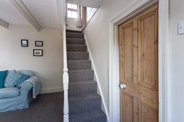 The steep cornish staircase takes you up to the first floor, there is a small step either side of the stairs, leading into the bedrooms.